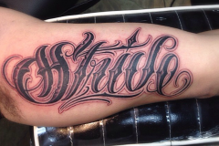 Black and Grey script tattoo